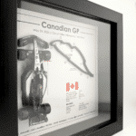 Black-framed Kimi Antonelli Canadian GP 2026 artwork with a miniature racing car on the left, raised circuit on the right and Canadian flag below.