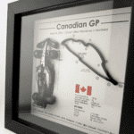 Black-framed Kimi Antonelli Canadian GP 2026 artwork with a miniature racing car on the left, raised circuit on the right and Canadian flag below.